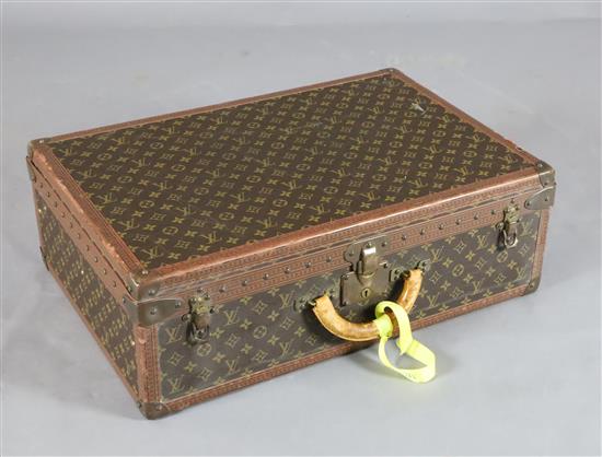 A Louis Vuitton suitcase, 25.75 x 17.5 x 8.5in.